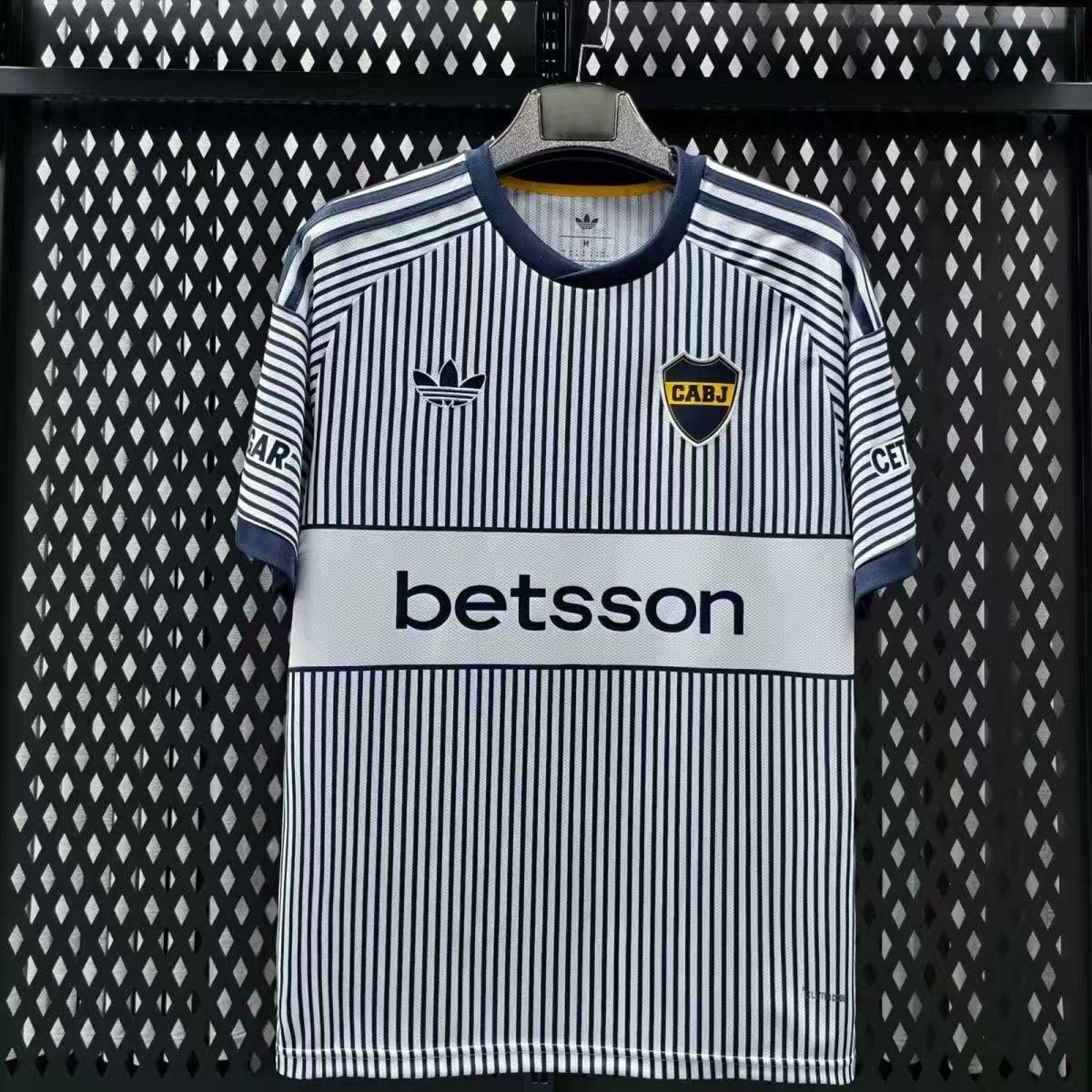 Front view of Boca Juniors 2026/2027 navy and white striped away player jersey